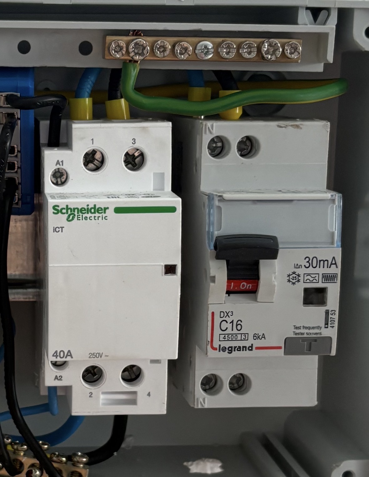 Garage sub-panel: Schneider iCT A9C20842 contactor on the left, Legrand DX³ 410753 C16 / 30 mA Type F RCBO on the right. A photo cannot validate cable sizing, terminal torque, earthing or compliance.